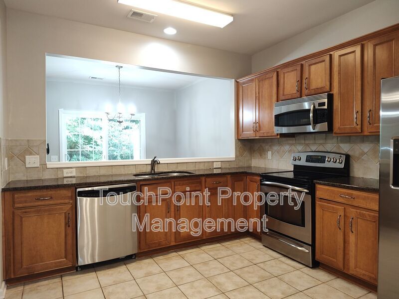 Cozy, 2 story End Unit Townhome located in the Blakeney Preserve community! property image