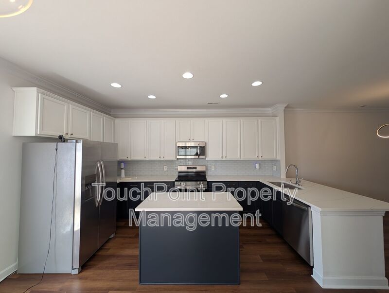 Pristine End Unit Townhome located in the Prosperity Place community! property image